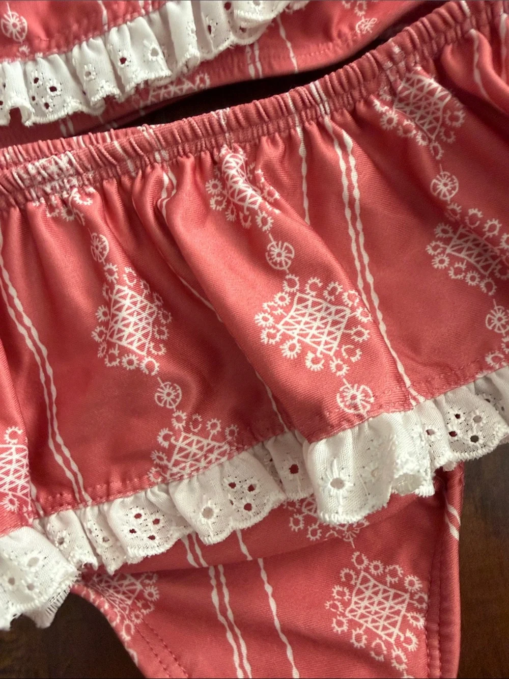 Well Dressed Wolf (Wildling) Coral Ruffle Bikini with White Eyelet Trim
